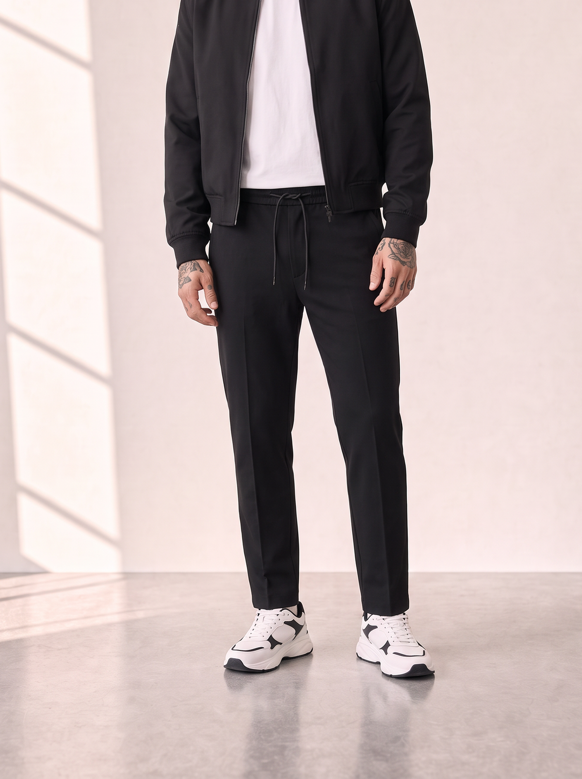 COMO TAPERED DRAWSTRING PANTS - LES DEUX – BLACK - Hero Front